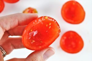 sliced grape tomatoes for low carb halloween caprese eyeballs