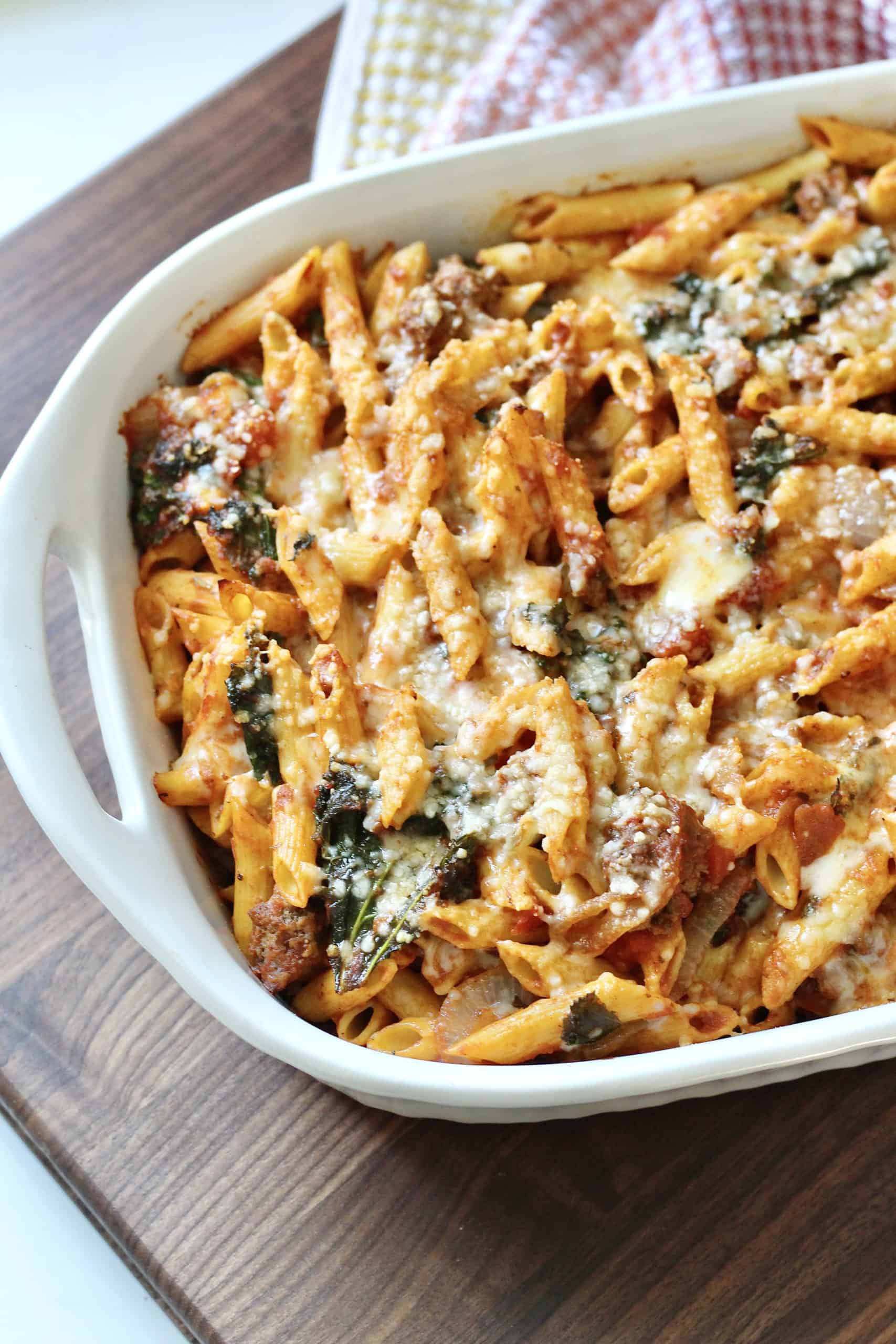 cheesy ground beef pasta in white casserole dish