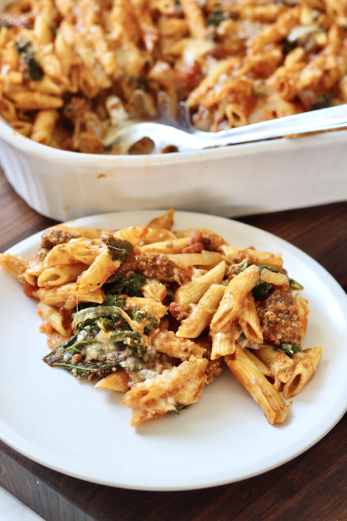 cheesy ground beef pasta on white plate