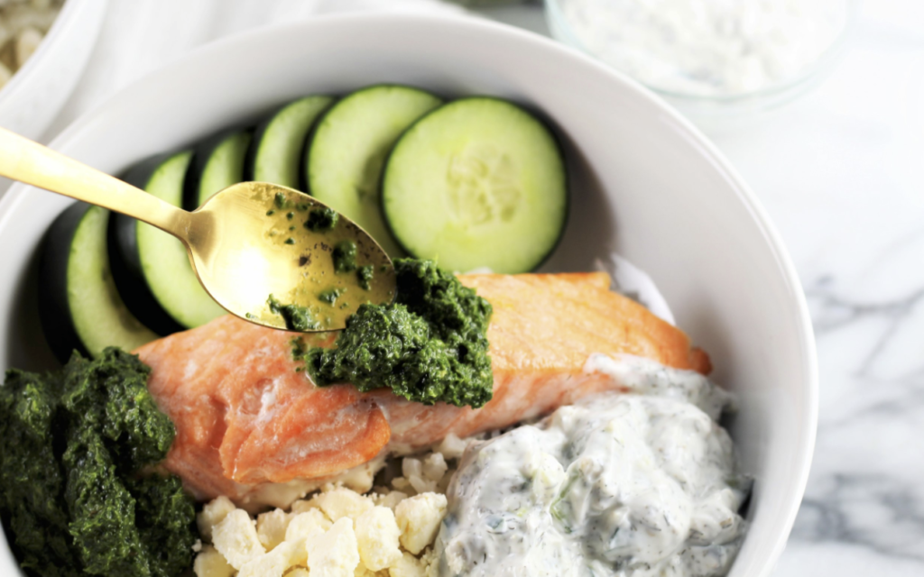 salmon in bowl with cucumbers and pesto how to cook salmon