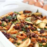 Caramelized Onion, Apple, and Sweet Potato Overnight Breakfast Bake in a white pan