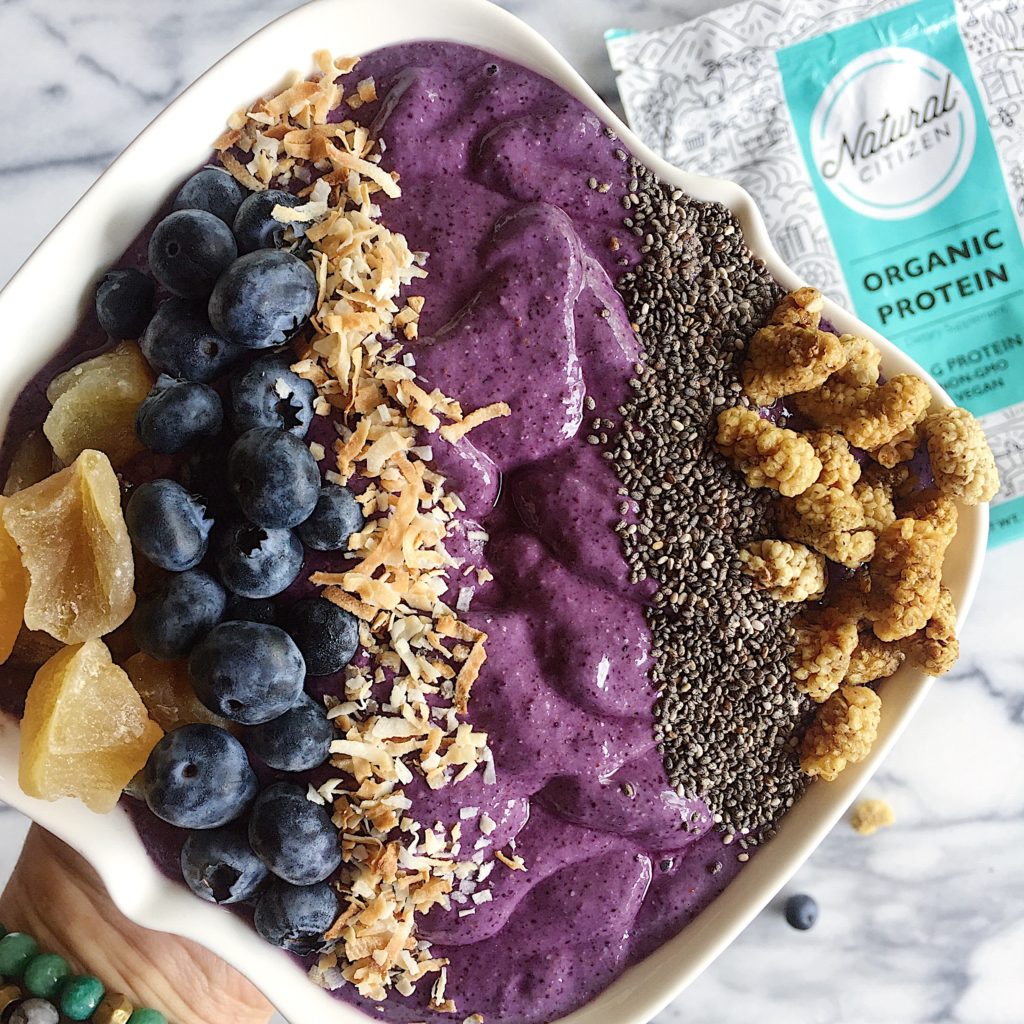 purple protein smoothie bowl with blueberries, coconut, chia seeds, gogi berries and natural citizen organic protein