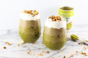 cups of Green Matcha Ombre Chia Pudding with container of matcha