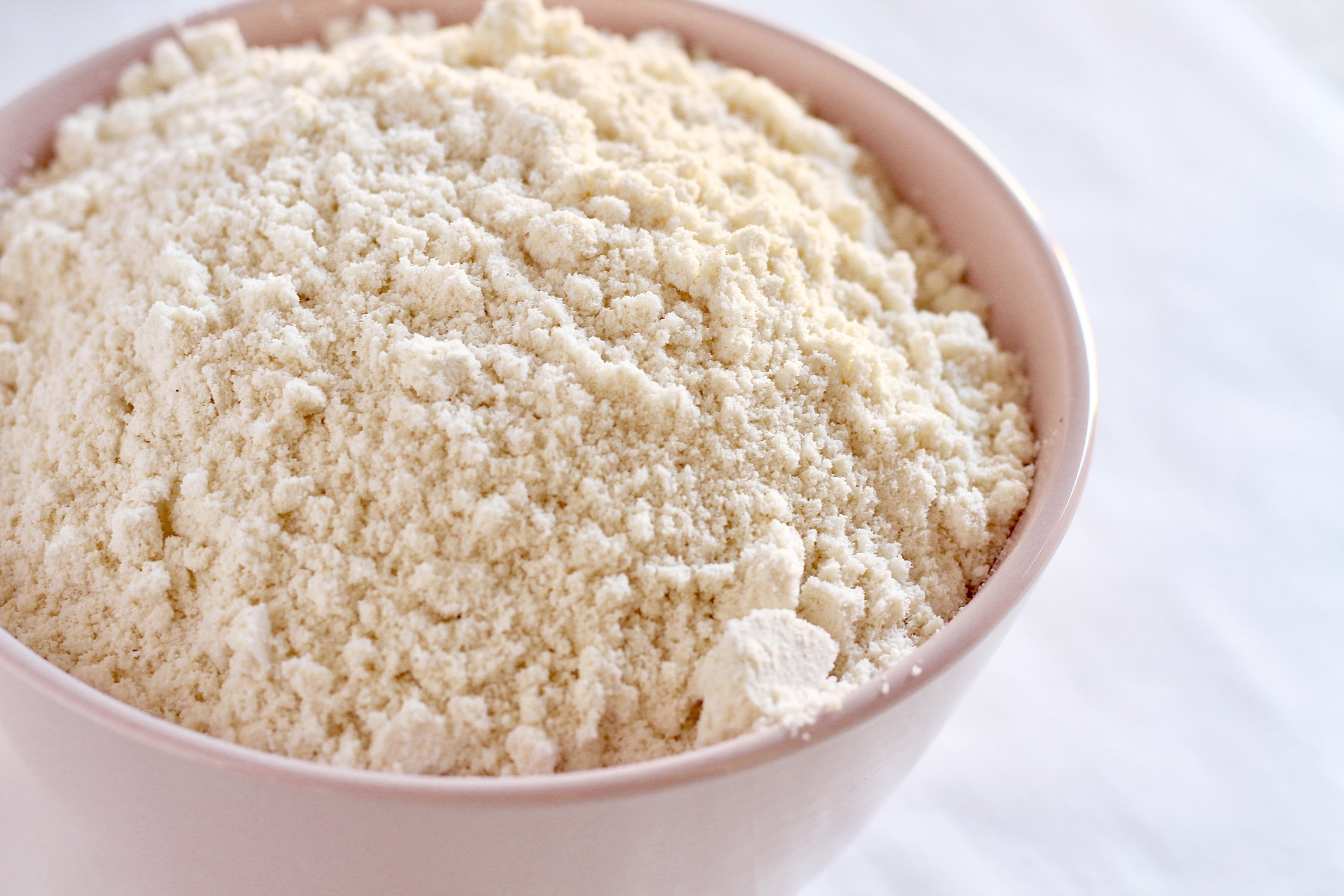 Homemade Paleo Flour Blend | Milk & Honey Nutrition Homemade Paleo Flour Blend side view in pink bowl