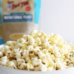 Homemade Zesty Ranch Popcorn Perfect for Movie Night with bag of bobs red mill nutritional yeast