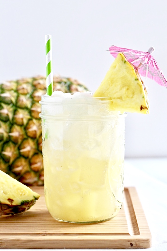 Low Sugar Sparkling Pina Colada with pink umbrella for type 1 diabetes and alcohol