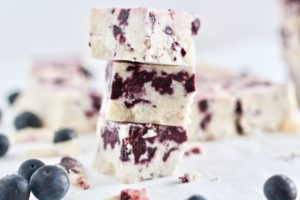 No-Cook Blueberry Vanilla Fudge stacked on counter