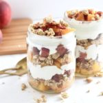 Peaches & Cream Parfaits with Maple Bacon Crumbles in mason jars with peaches on cutting board