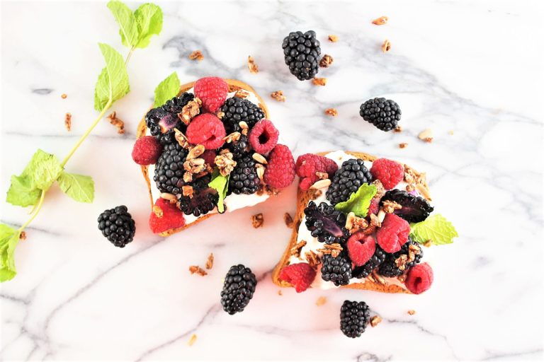 slices of toast with berries and mint toppings