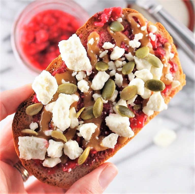 Toast topped with peanut butter, jelly, and feta