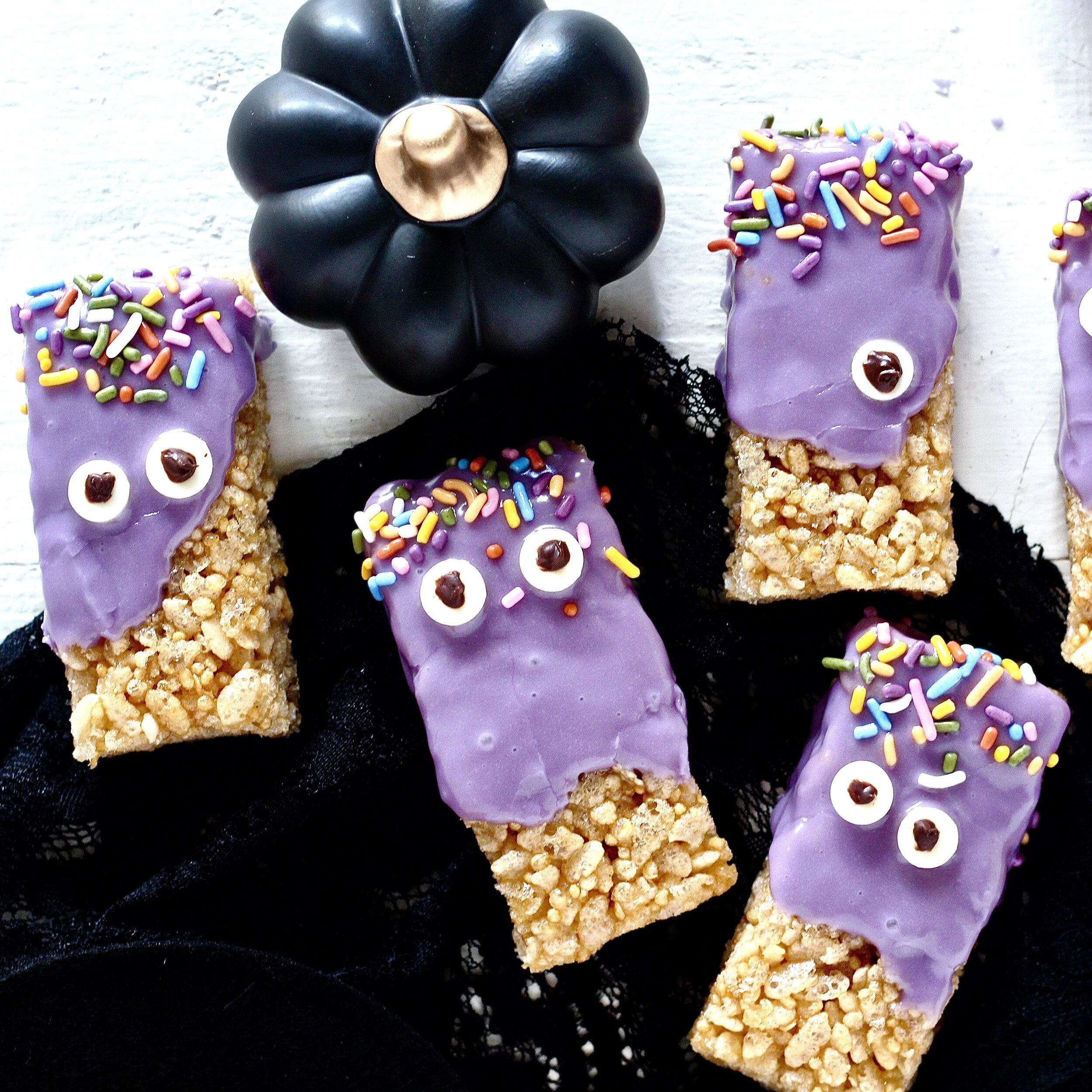 Purple Monster Halloween Treats | Milk & Honey Nutrition Purple Monster Halloween Treats with black pumpkin