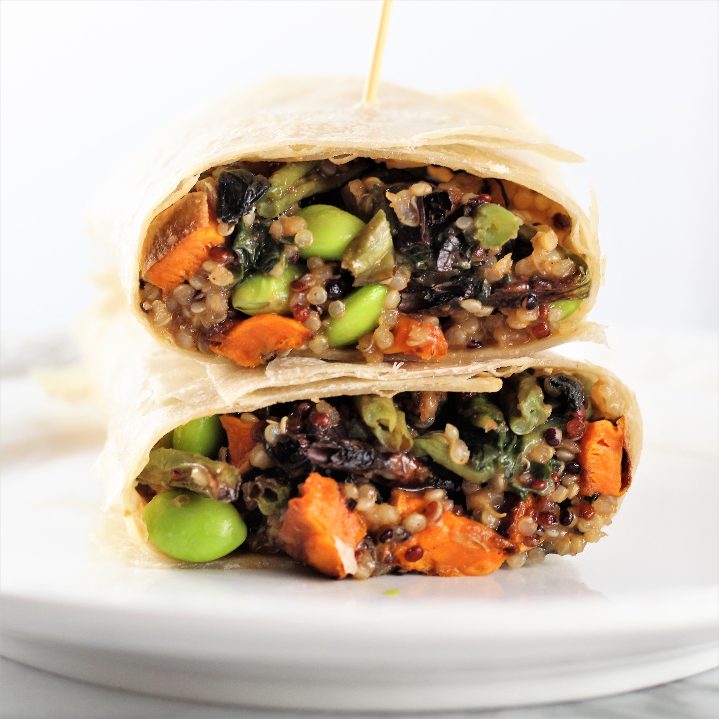 Thai Veggie Protein Wraps | Milk & Honey Nutrition Thai Veggie Protein Wraps stacked on a plate
