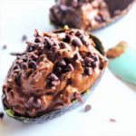 avocado cacao mousse in avocado skin with chocolate chips