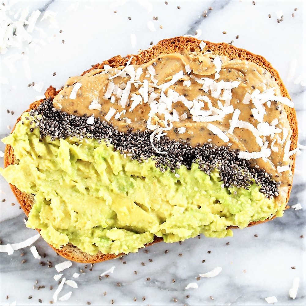 avocado peanut butter toast with half avocado, half peanut butter separated by chia seeds