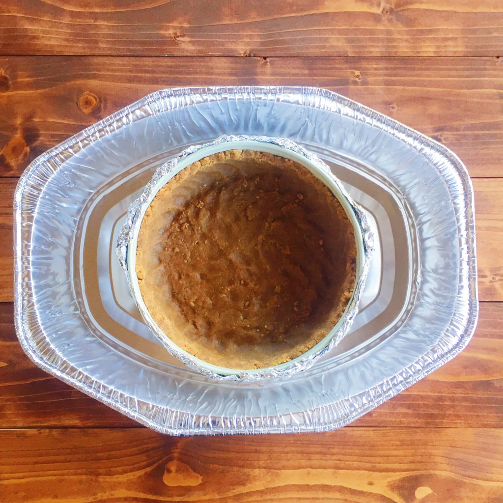 cheesecake making step in large tin pan
