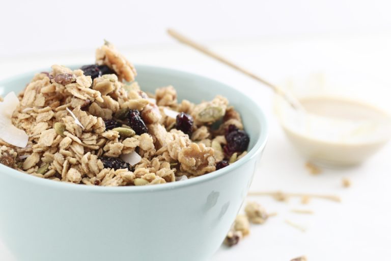 cranberry maple tahini granola in turquoise bowl