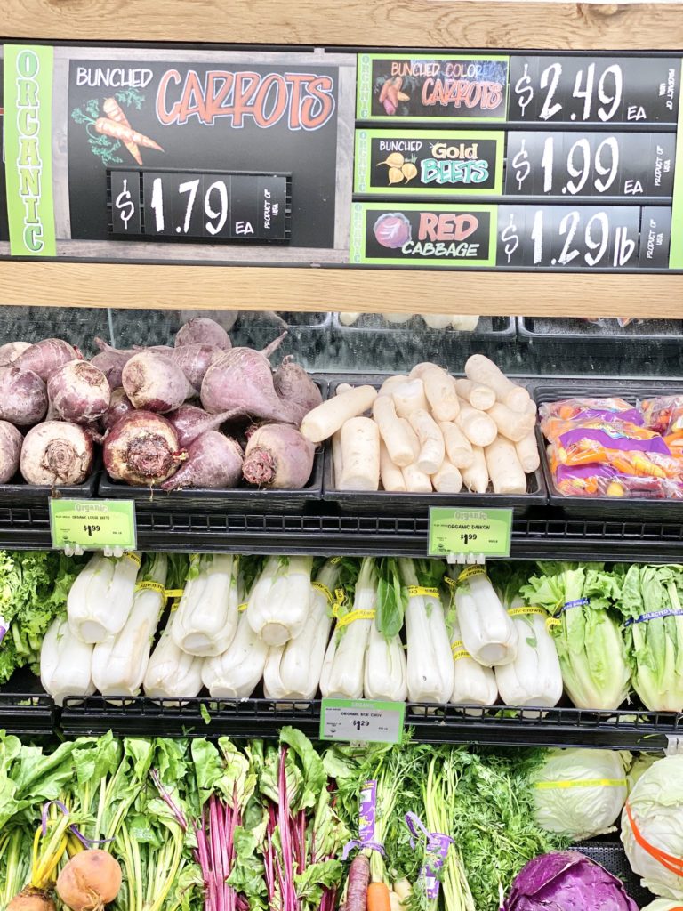 produce section at sprouts beets carrots cabbage