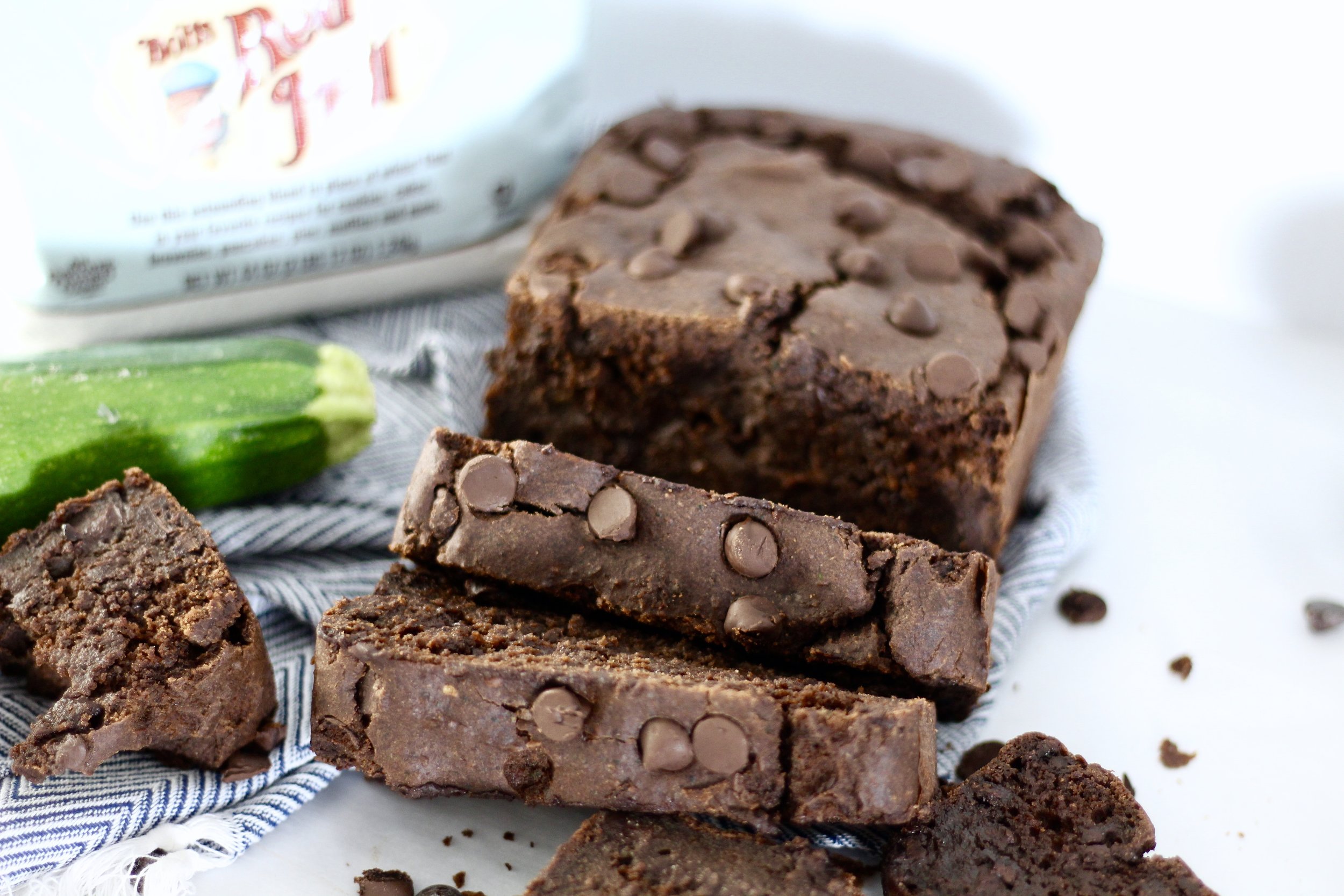 gluten free chocolate zucchini bread with bob's red mill mix in background