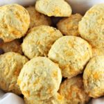 grain free cheesy rolls in a basket with a white cloth