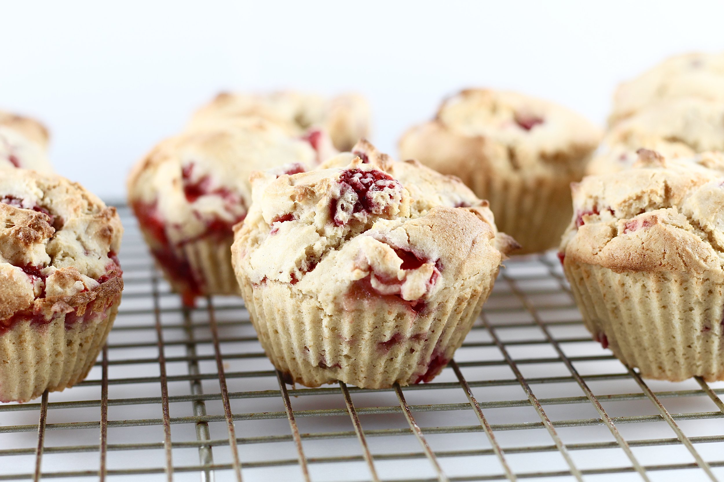 low sugar strawberry muffins on cooling rack