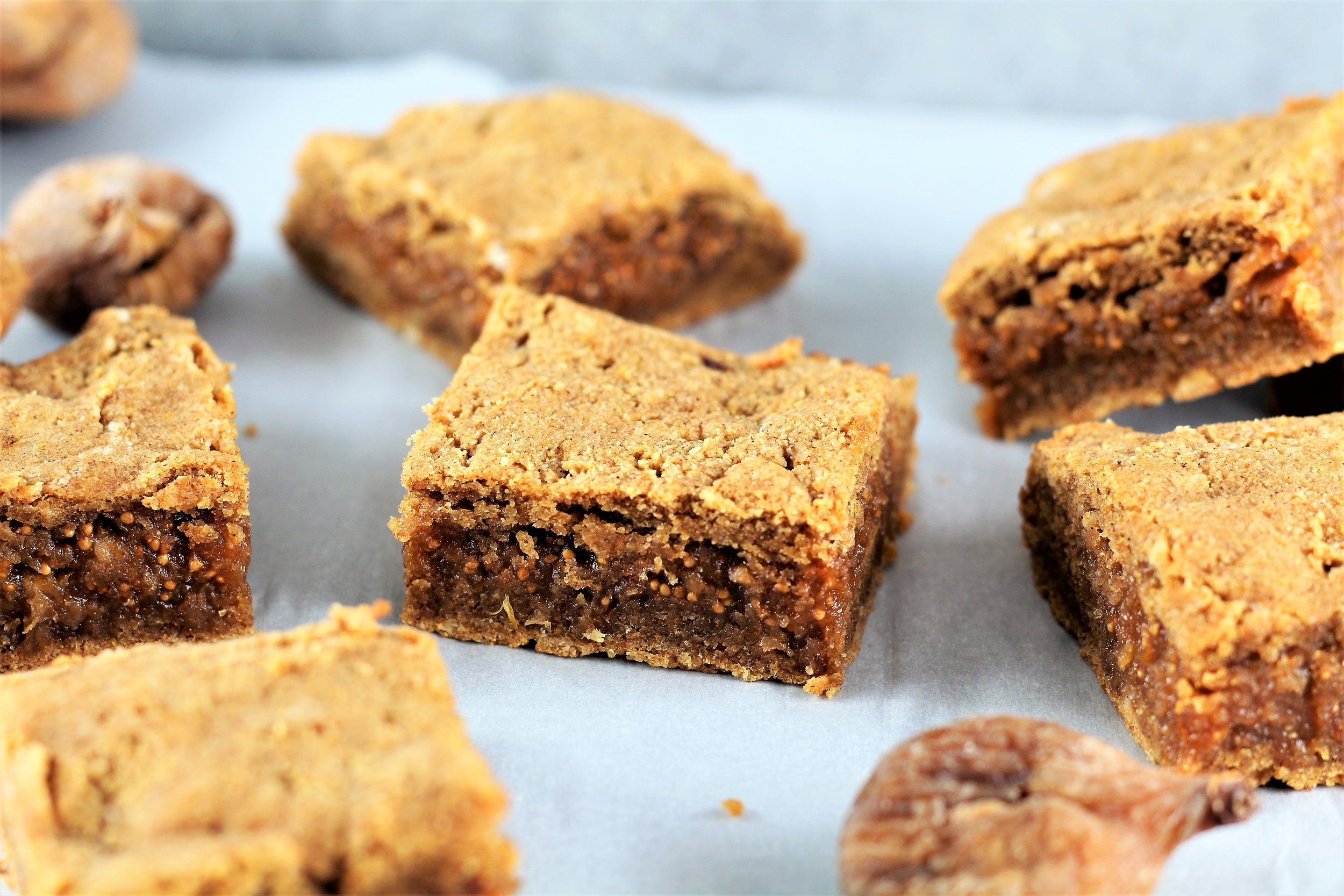 paleo fig bars | Milk & Honey Nutrition paleo fig bars scattered on counter