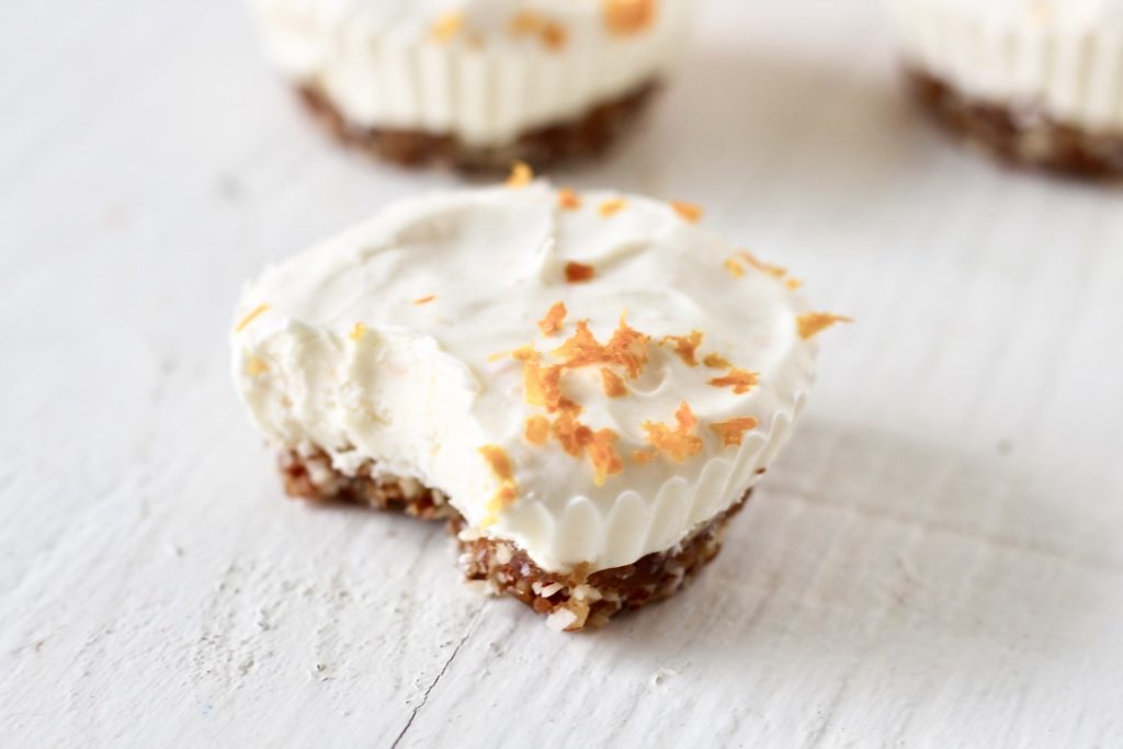 Orange No Bake Cheesecake Cups 4 | Milk & Honey Nutrition cheesecake cup with bite eaten