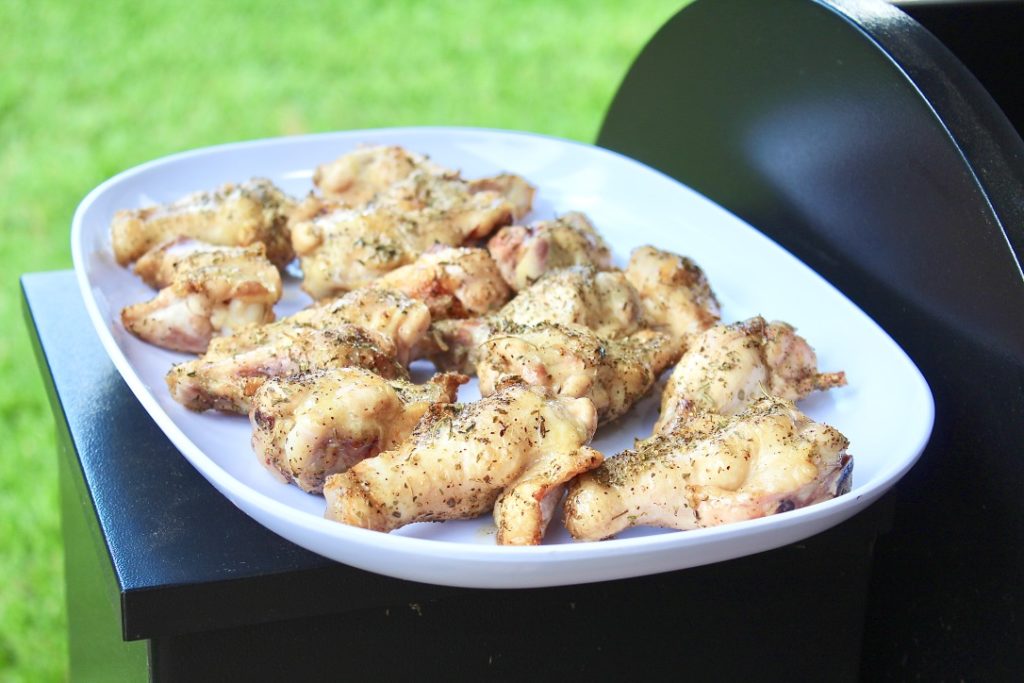 chicken wings on platter outside