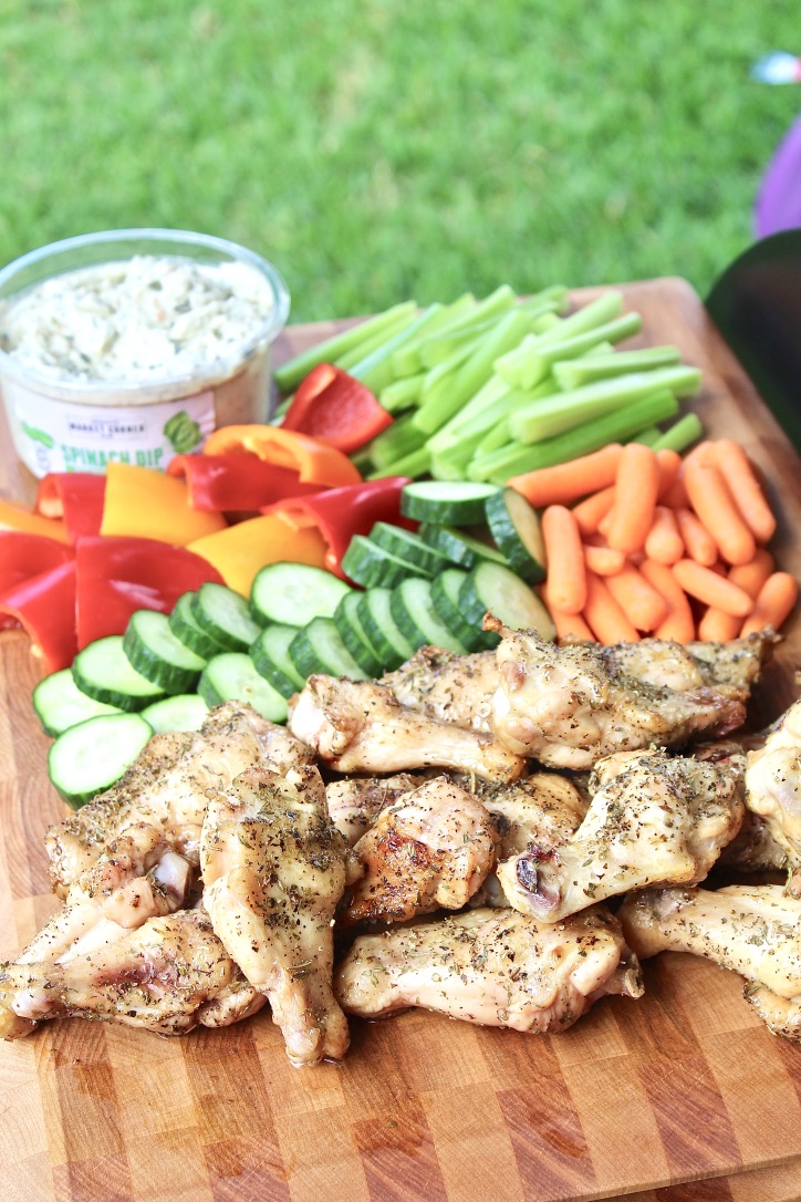 chicken wings and veggies on grill