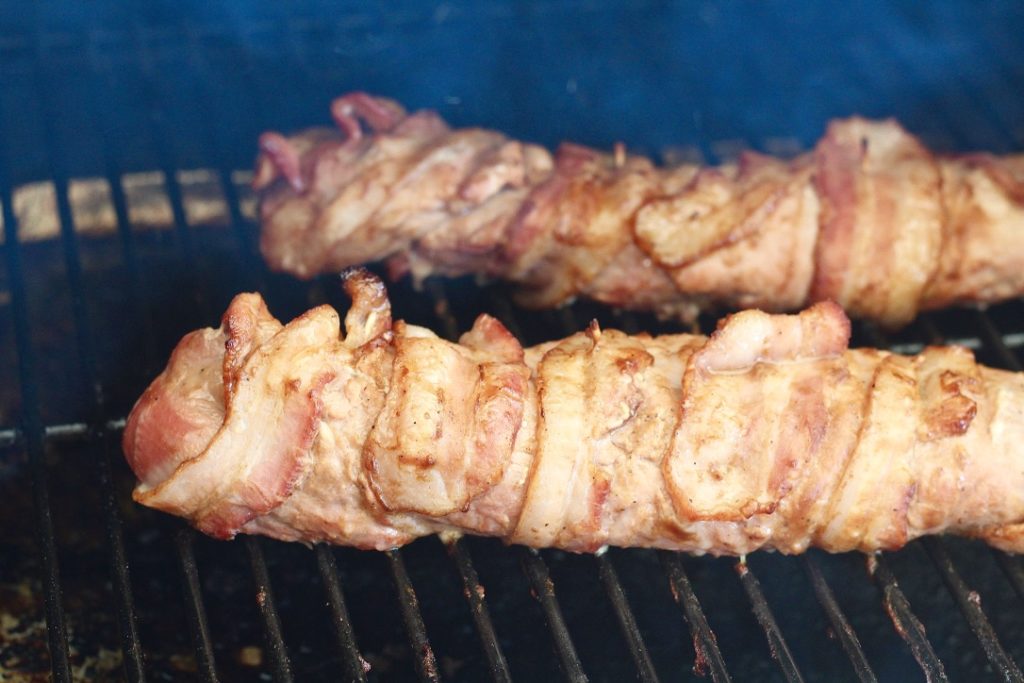 pork tenderloin wrapped in bacon on grill