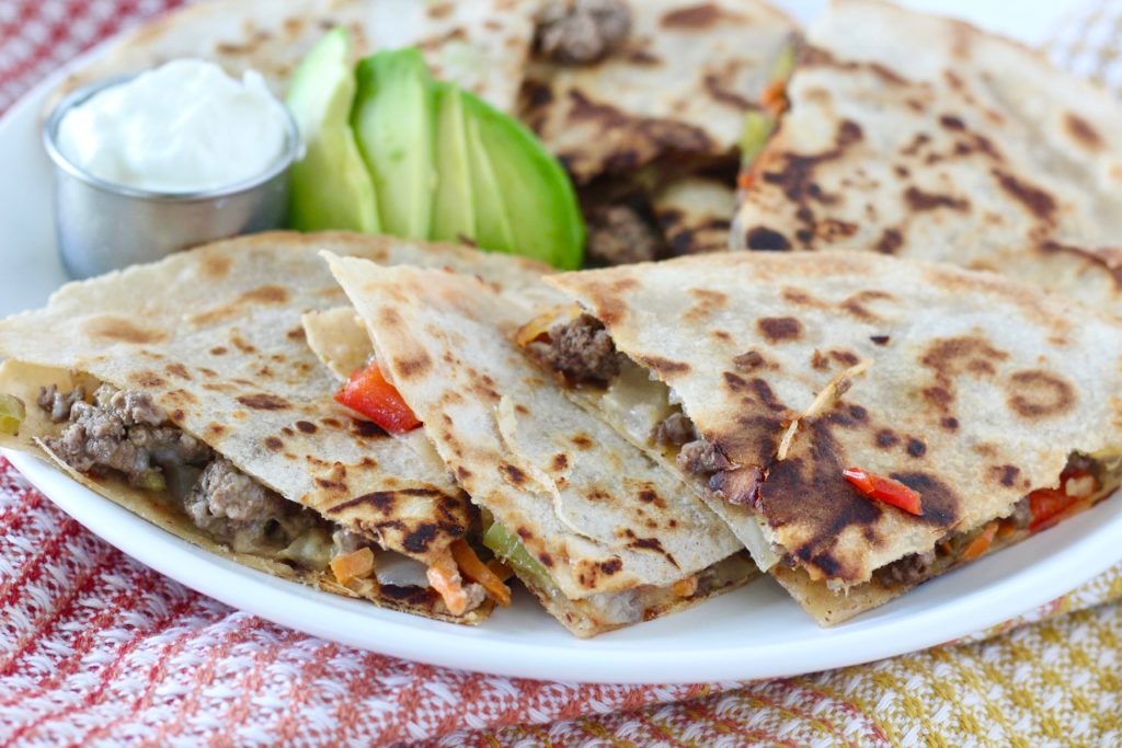 Cheesy Veggie & Ground Beef Quesadillas 1 | Milk & Honey Nutrition ground beef quesadillas on white plate