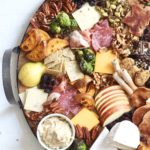 fall charcuterie board on round wood and metal platter