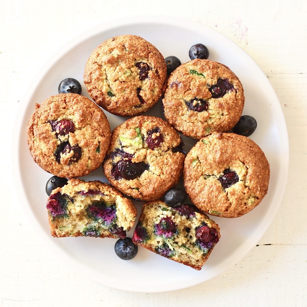 Gluten Free Blueberry zucchini muffins 1 | Milk & Honey Nutrition blueberry zucchini muffins on white plate