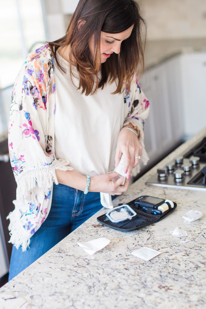 woman with diabetes changing insulin pump infusion set