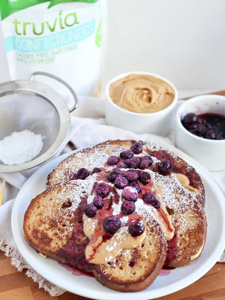 sourdough french toast on white plate truvia bag