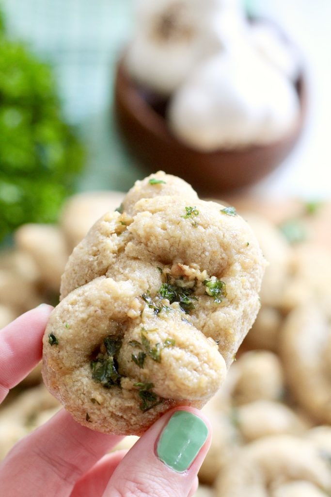 hand holding gluten free garlic knot