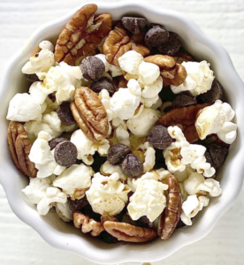 popcorn pecans chocolate chips trail mix in white bowl bedtime snacks for diabetes