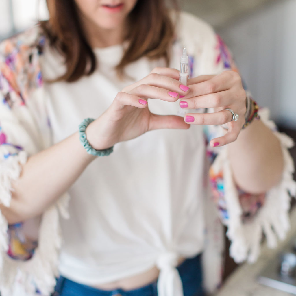 woman getting air bubbles out of syringe types of insulin