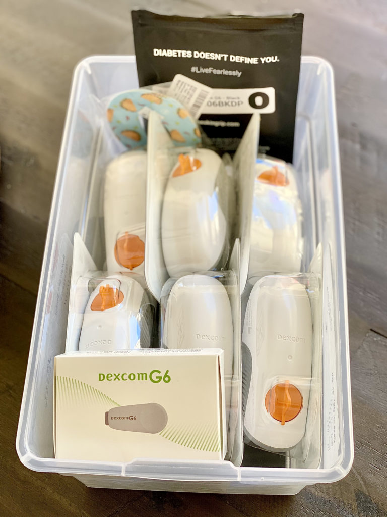 Dexcom supplies in white plastic basket