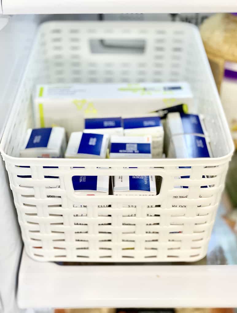 white plastic basket with insulin storage
