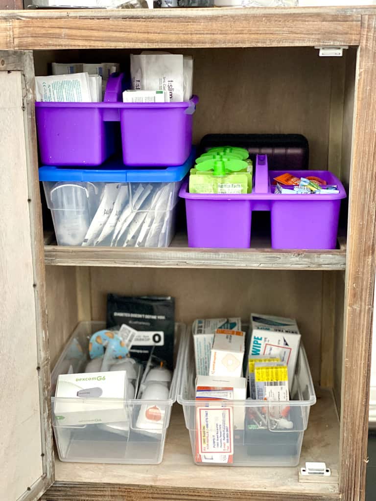 cabinet with organized diabetes supplies