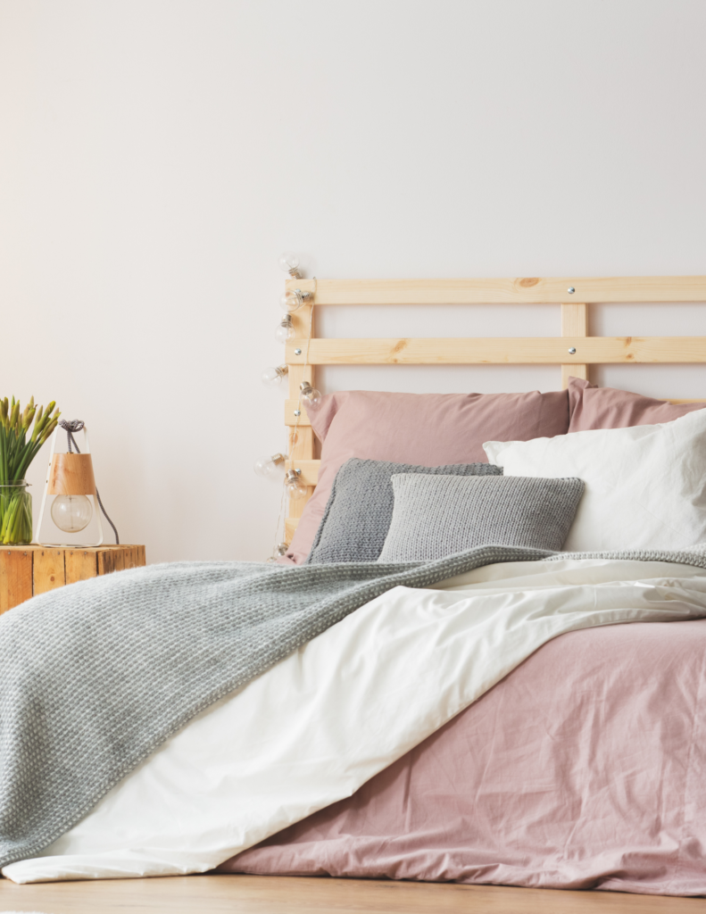 bed with pink blanket and wood frame boost energy for diabetes