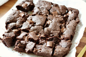 gluten free brownies on parchment paper with chocolate chunks