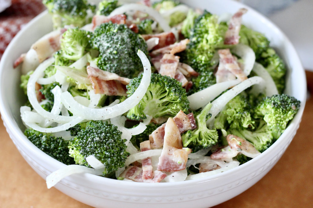 close up of low carb broccoli salad with bacon and vidalia onions