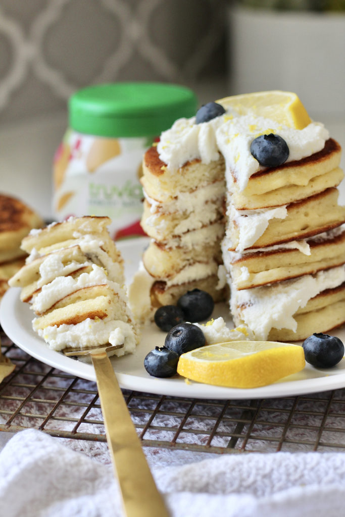 bite of lemon ricotta pancakes on gold fork