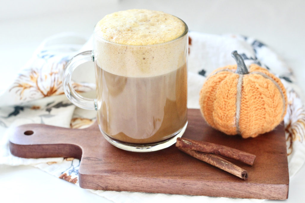 healthy pumpkin spice latte without whipped cream on cutting board