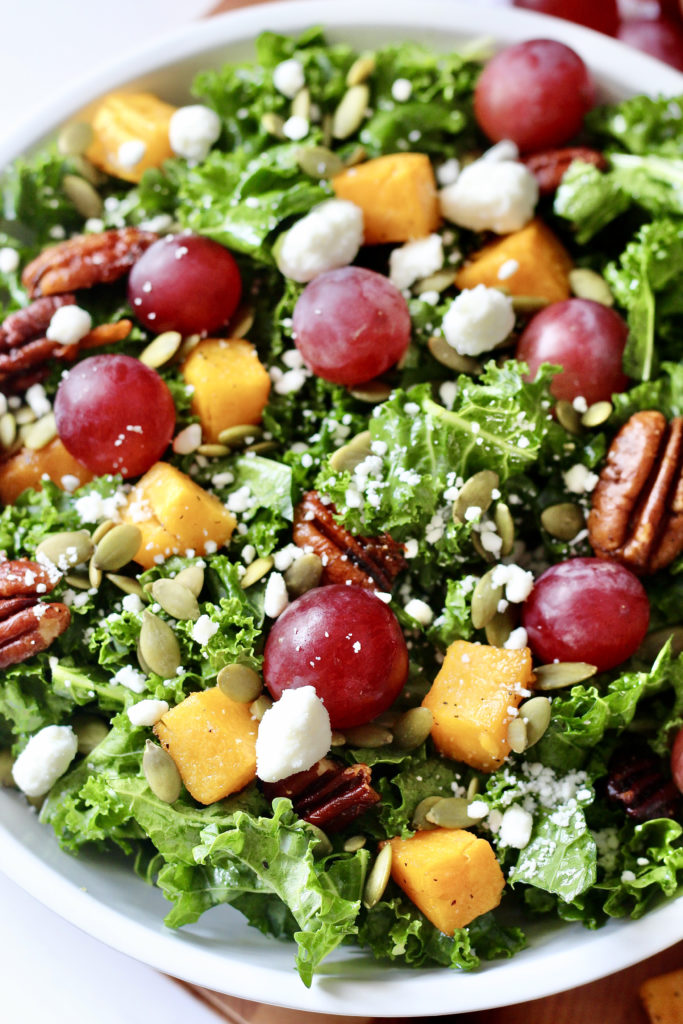 fall harvest salad with grapes butternut squash kale pecans and goat cheese