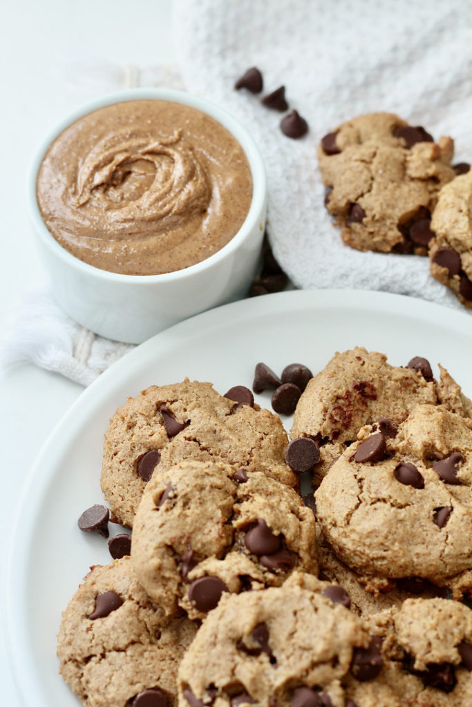 swirl of almond butter and almond butter chocolate chip cookies on plate