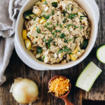 zucchini and squash casserole with shredded cheese and onion