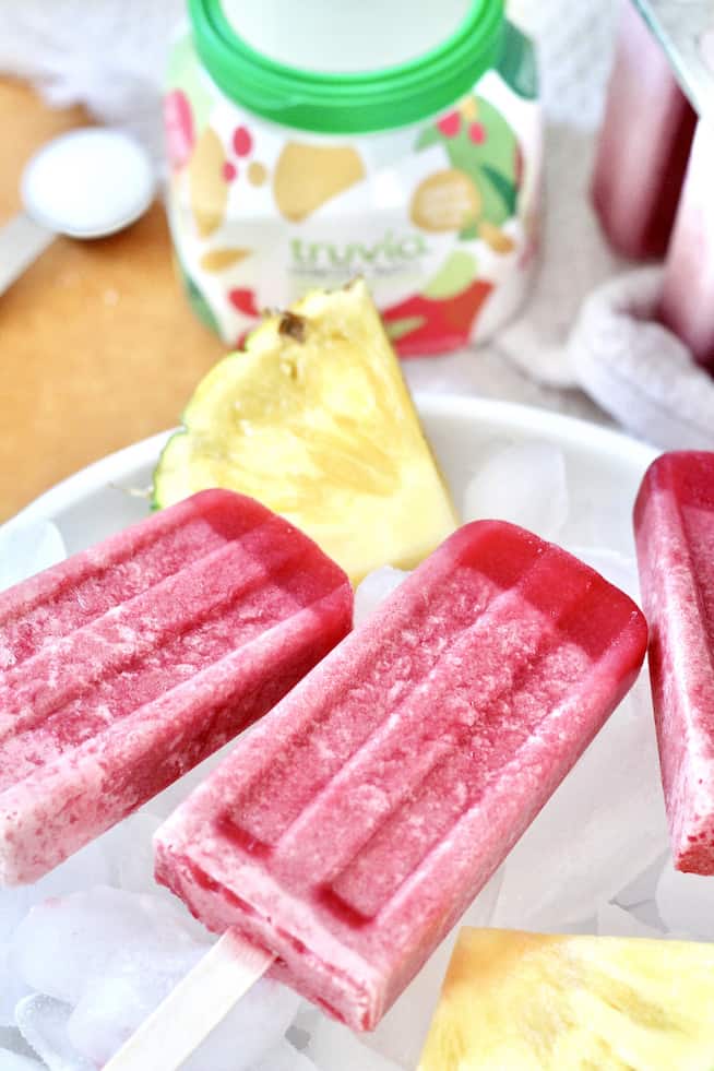 pineapple cherry popsicles in bowl of ice with truvia spoonable jar