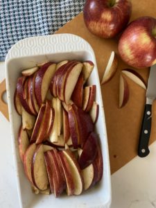 spiced apple slices in loaf pan for gluten free apple crisp